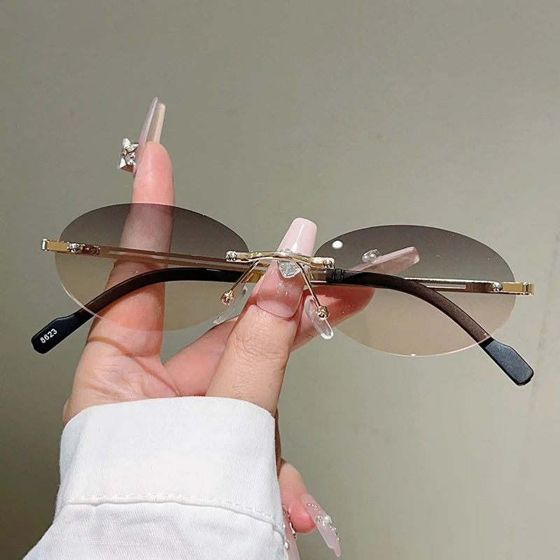 Designer Sunglasses - نظارات شمسية بيضاوية بدون إطار للنساء،